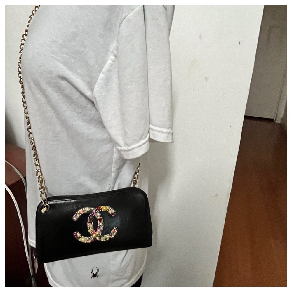 CHANEL Black and Gold Crossbody Bag with Iconic Design